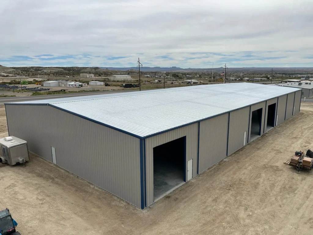 100x200 gable-roof commercial steel building with overhead door openings in Bloomfield, NM