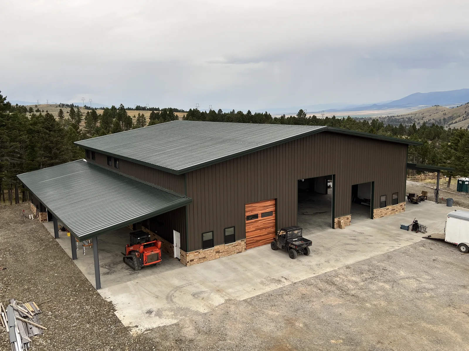 80x80 steel workshop with covered lean-to porch erected by Mountain State Construction in Townsend, Montana